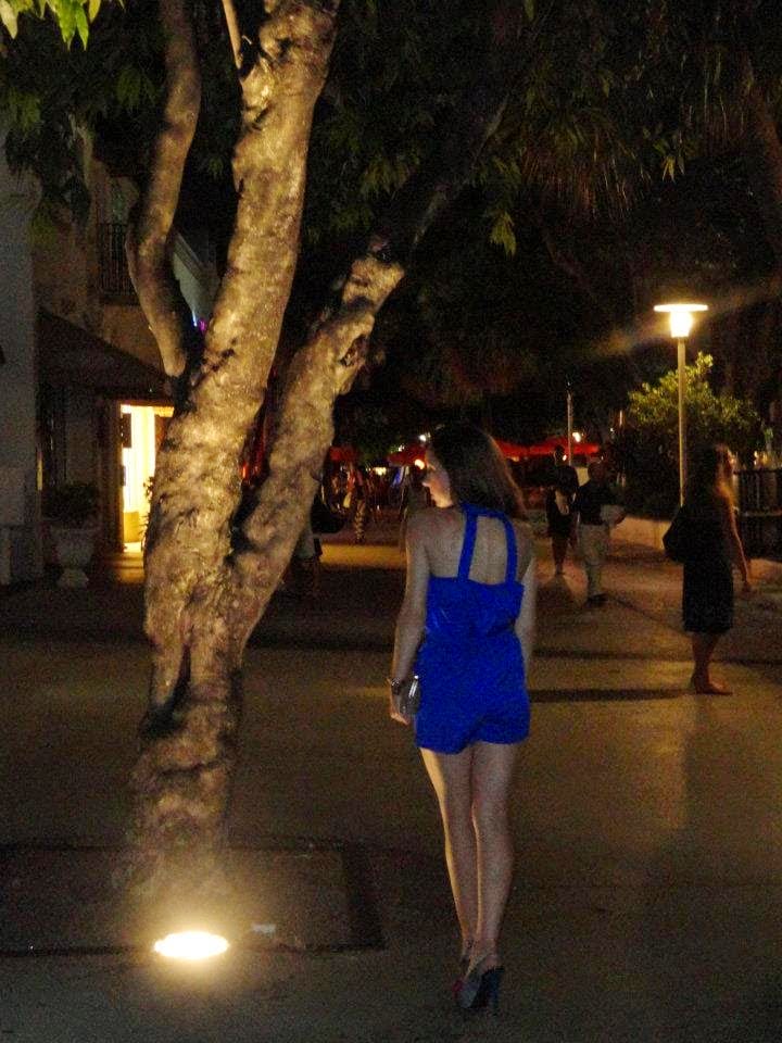 Blogger Nihan wearing a chic and elegant mini blue romper with high-heels