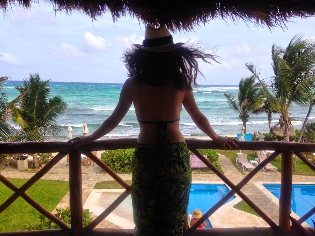 Blogger Nihan looking out of her balcony in Las Villas Akumal in Akumal, Tulum Mexico