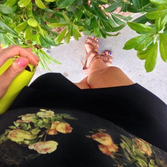 Blogger Nihan showing her black and green fun summer brunch outfit by the pool at the W Hotel in San Diego