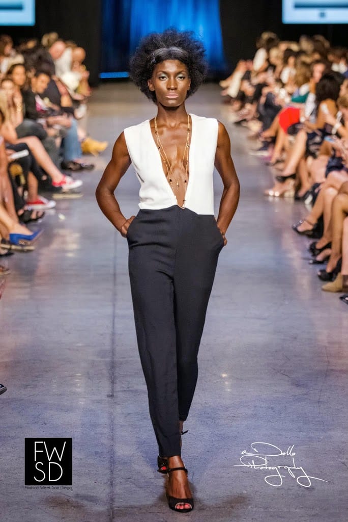 Model wearing a black and white romper walking down the runway during Fashion Week San Diego 2014 Night 3