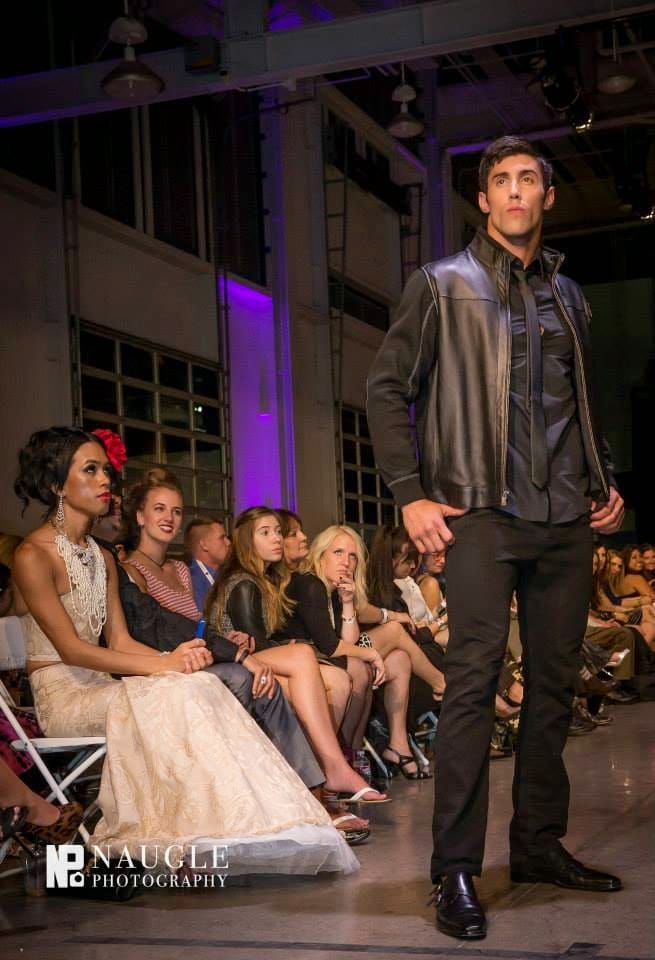 Model wearing leather jacket and leather shoes