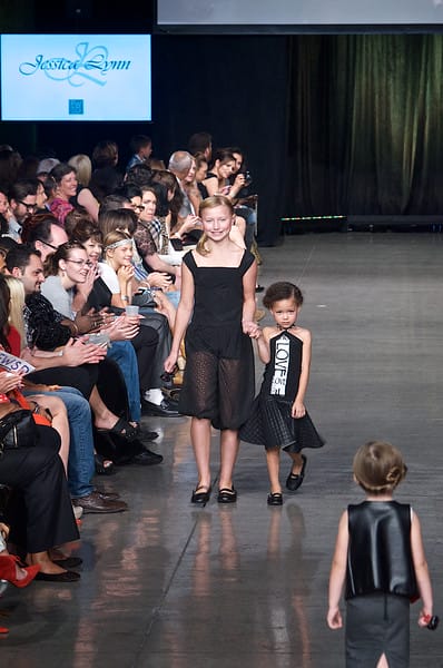 Pretty teenage girl and a little girl model walking down the runway on Fashion Week San Diego 2014 Night 2