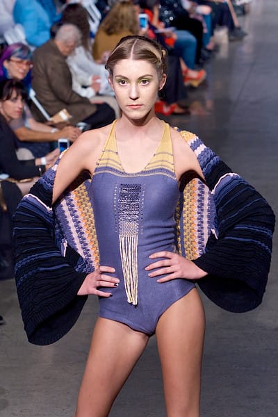 Model in purple printed knit swimsuit and matching kimono walking down the runway on Fashion Week San Diego 2014 Night 2