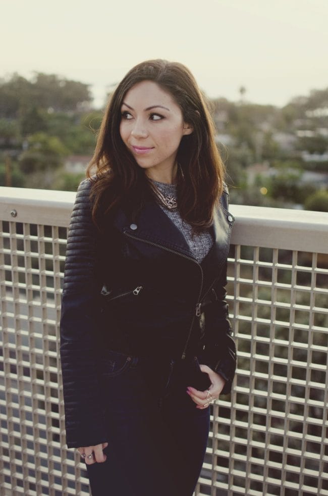 Blogger Nihan posing and looking back, showing her edgy and cool leather jacket