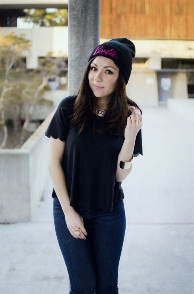 girl dressed in black showing her outfit