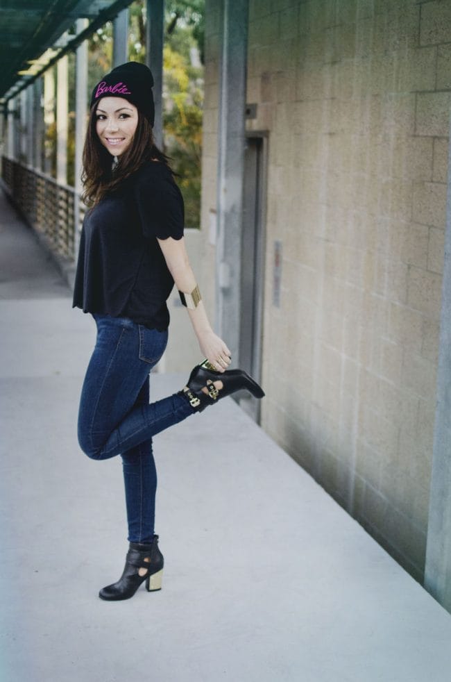 Girl wearing fancy black booties