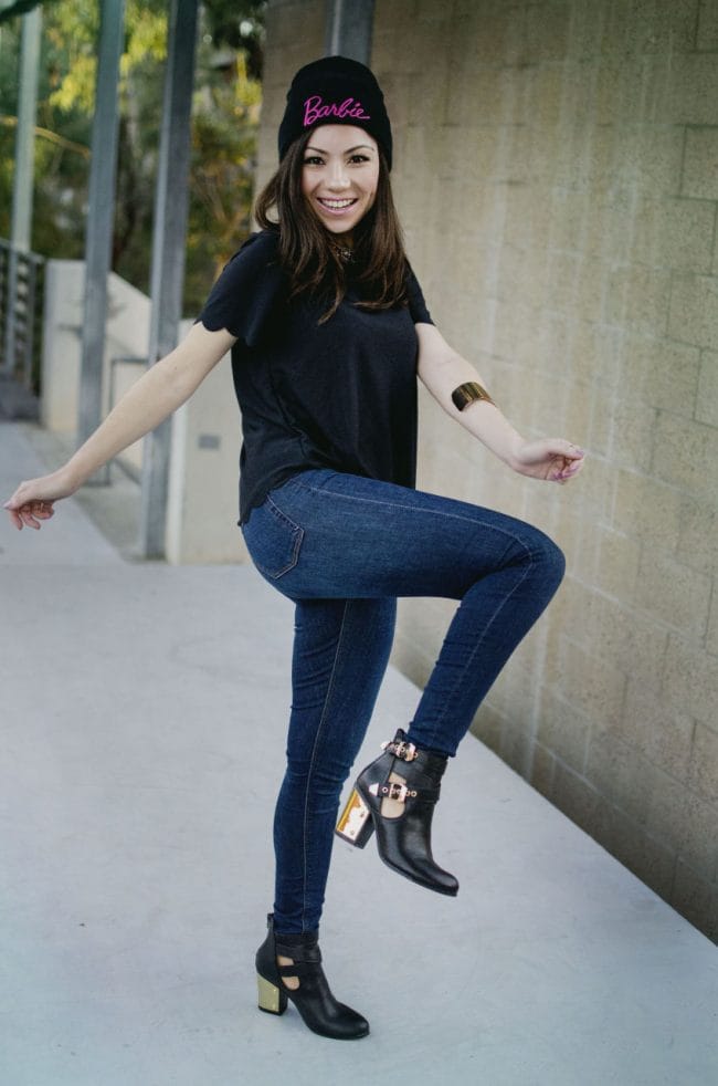 Girl showing off her black and gold fancy booties