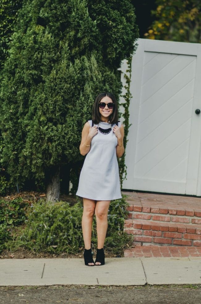 Nihan Gorkem wearing baby blue Asos mod dress black and gold Nasty Gal backpack JustFab black open toe booties and jewelry - winter baby blues