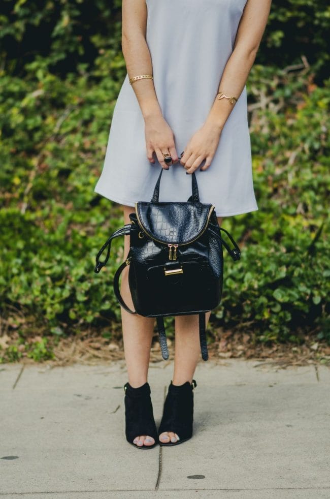 Nihan Gorkem wearing baby blue mod dress black gold backpack black open toe booties - winter baby blues