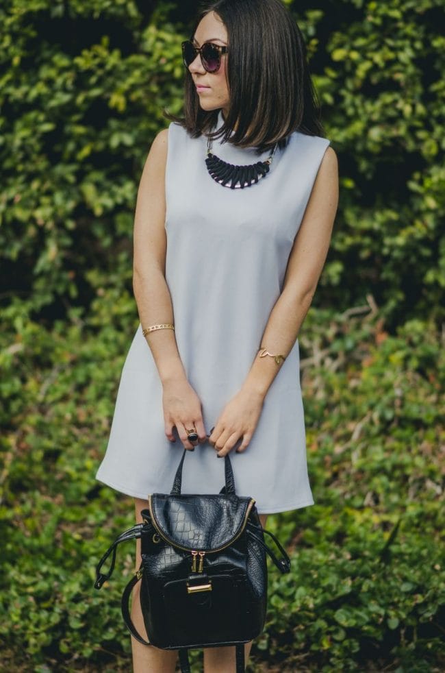 Nihan Gorkem wearing baby blue mod dress black gold backpack black open toe booties - winter baby blues