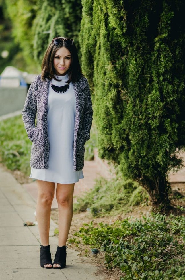 Nihan Gorkem wearing baby blue mod dress black and white tweed coat black open toe booties and posing - winter baby blues