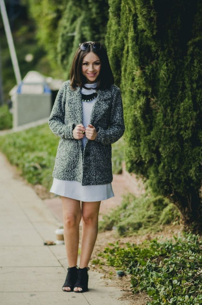 Nihan Gorkem wearing baby blue mod dress grey white coat black and gold backpack black open toe booties and jewelry - winter baby blues
