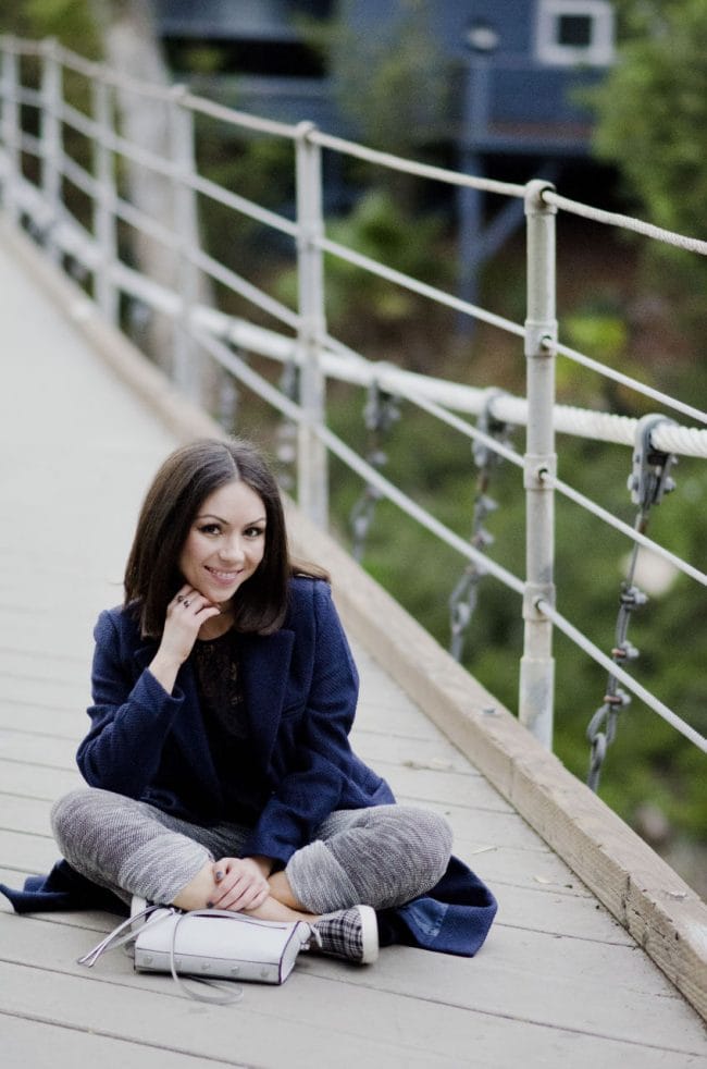 Nihan sitting on Suspension Bridge and showing her outfit