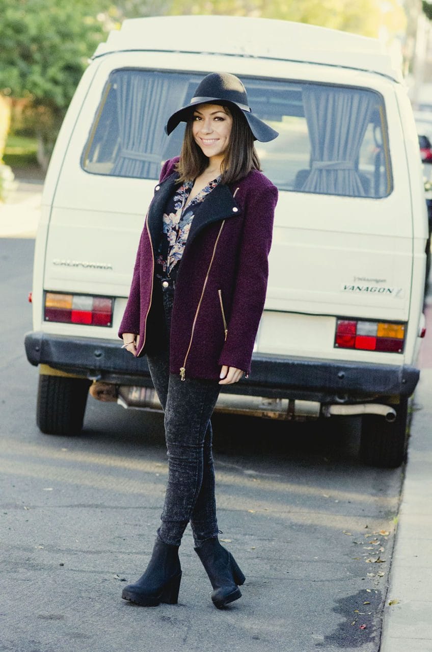 Nihan wearing ASOS floral shirt, H&M floppy hat, jeans, boots, River Island structured bag and Maroon jacket