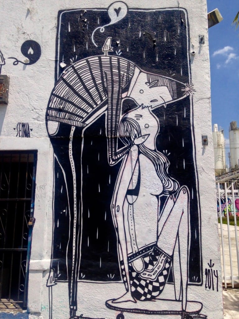 Kissing couple cartoon mural in Wynwood Walls, Miami