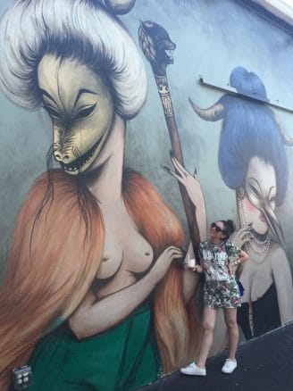 Miss Van 2 Nihan in front a Miss Van mural in Wynwood Walls, Miami