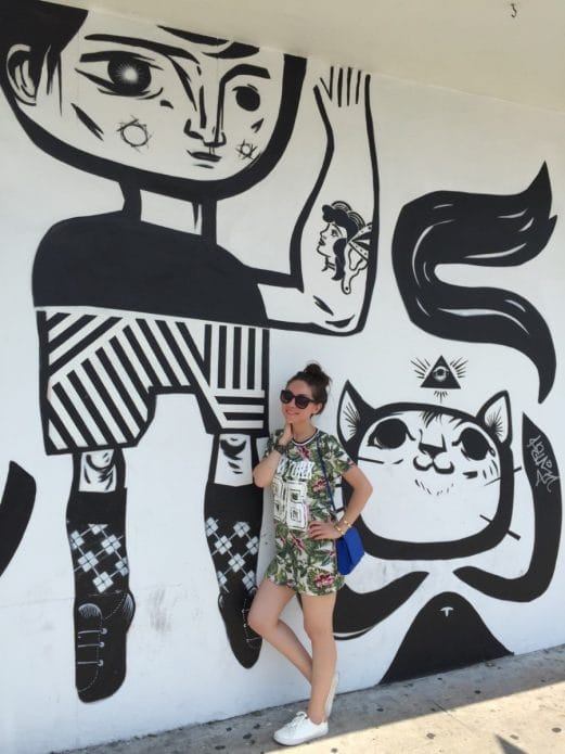 Black and white boy and cat mural in Wynwood Walls, Miami Black and white boy and cat mural in Wynwood Walls, Miami