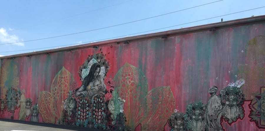 Mother breast-feeding her child mural by Swoon in Wynwood Walls Miami