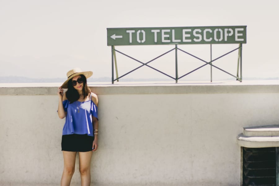 Nihan wearing perwinkle blue Topshop cold shoulder top, Brandy melville shorts and Lack of Color Spencer Fedora at Griffith Observatory in Los Angeles