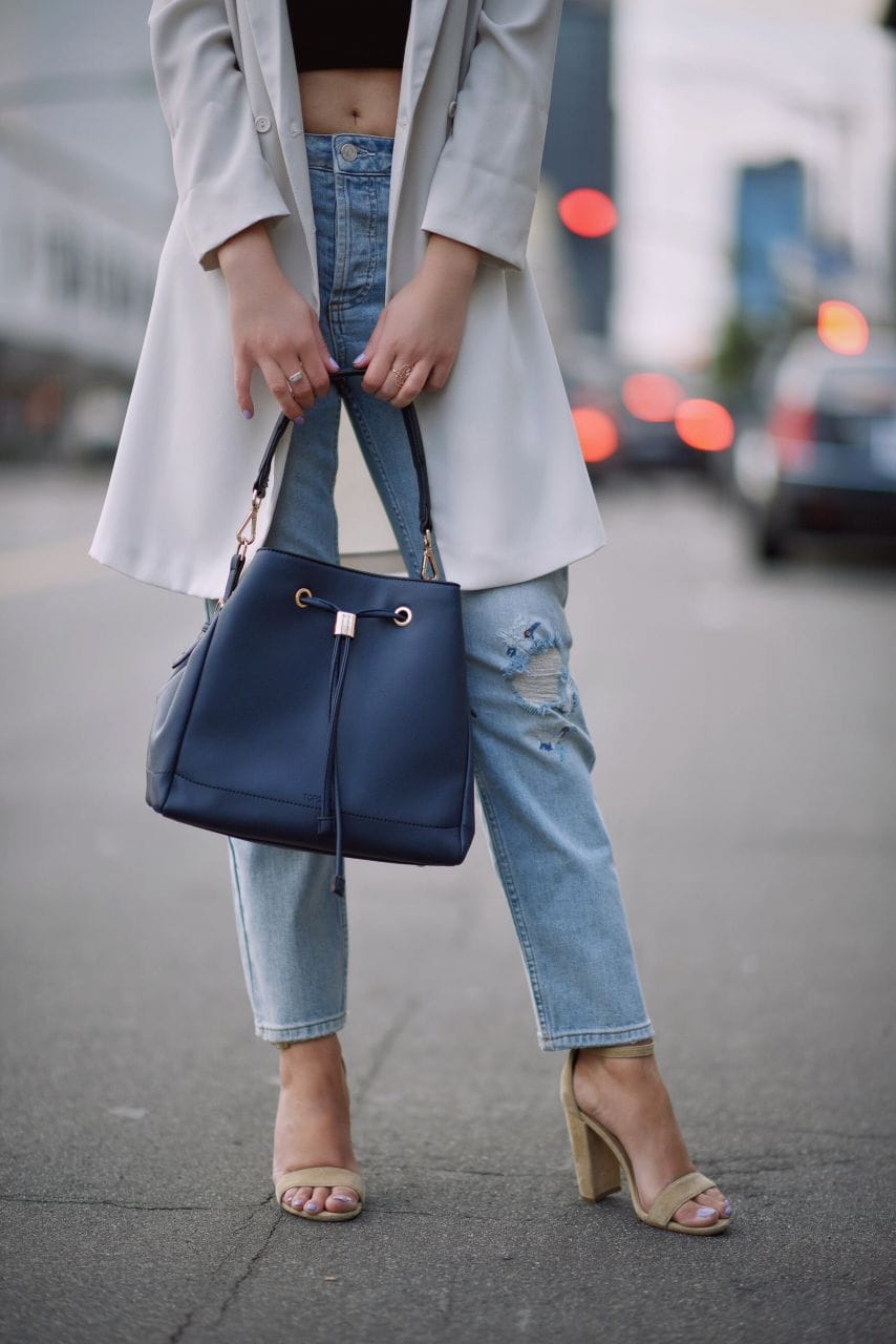 Topshop white blazer and boyfriend jeans, navy bucket bag