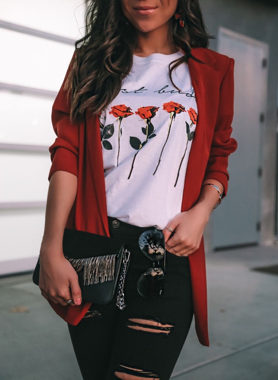 Casual Holiday Party Look: red blazer and black ripped denim