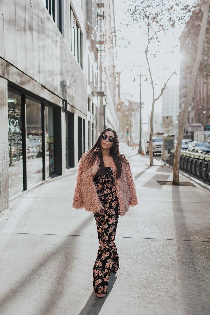 Channel Your Inner Flower Child In a Floral Jumpsuit