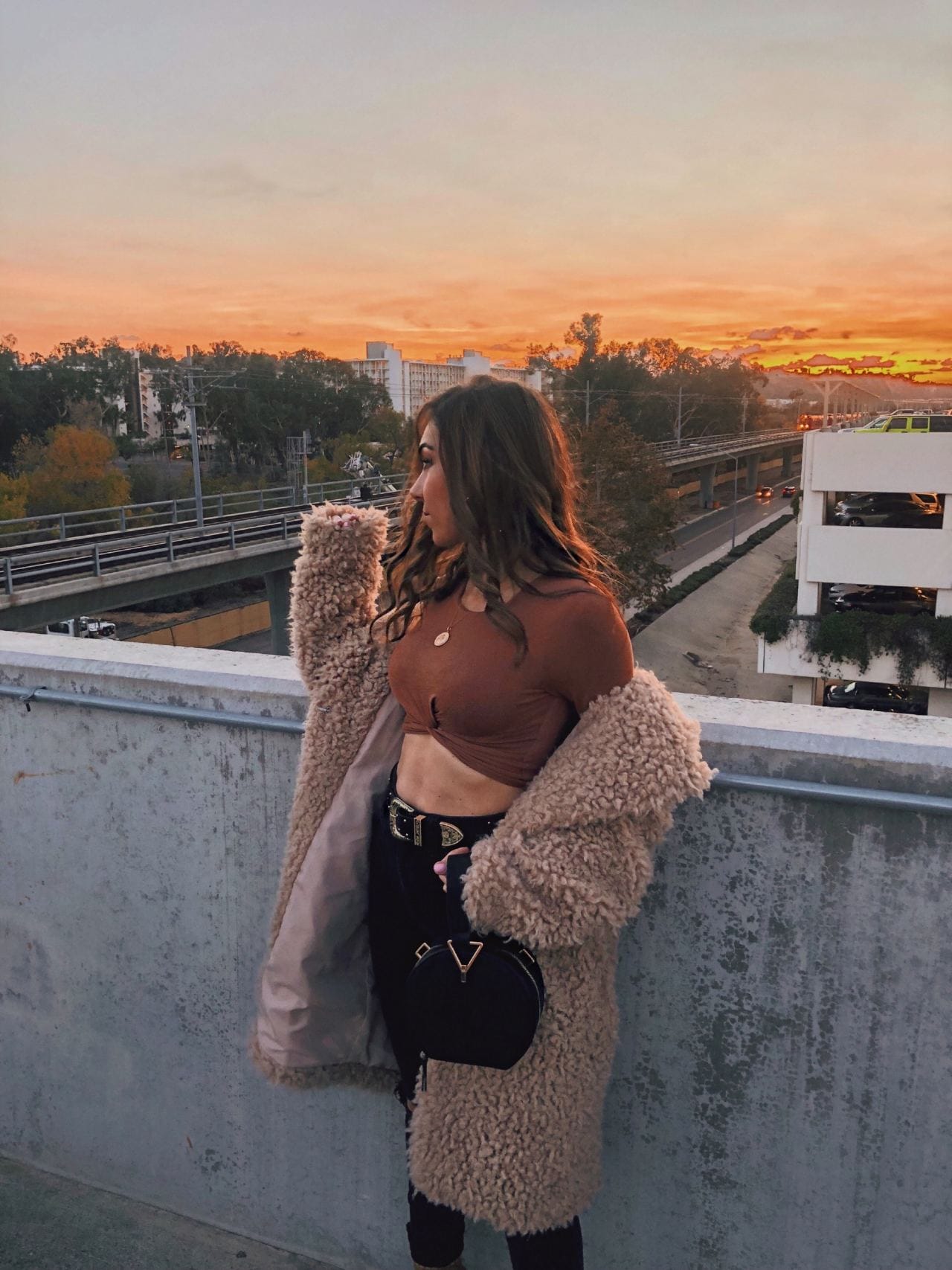 Style_with_Nihan_Circle_Bag_Trend_Mango_metal_handle_circle_bag_Revolve_fuzzy_coat_crop_top_Fashion_Valley_San Diego