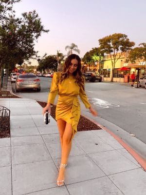 Style with Nihan wearing NBD Gold Backless Puff Sleeve Dress from Revolve