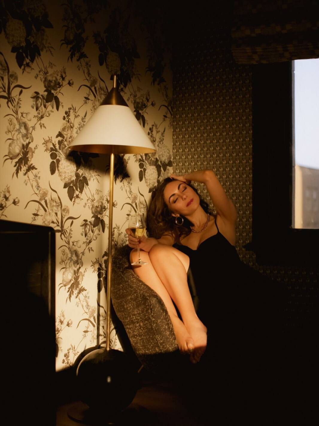 Style Blogger StylewithNihan wearing black Zara slip dress at golden hour San Francisco Proper suite